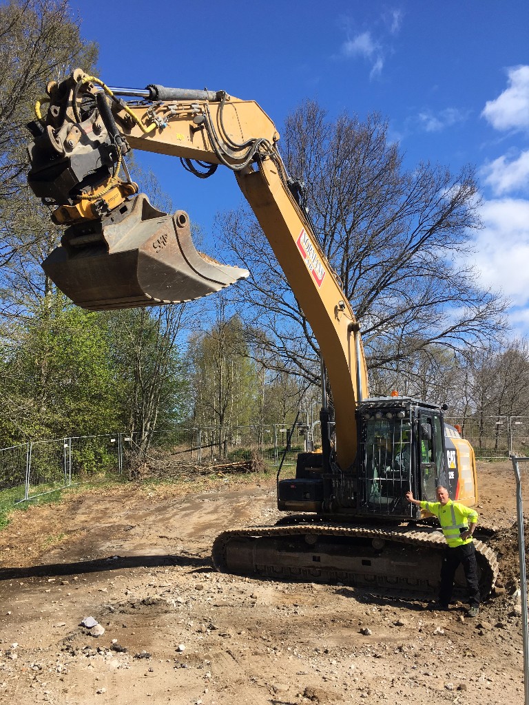 excavator with worker